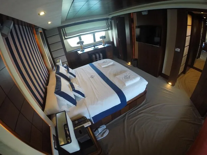  Yacht Photos Pics Luxurious bedroom interior on 2008 Azimut 95 yacht, featuring elegant bedding and modern decor.