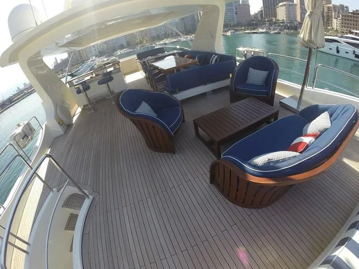  Yacht Photos Pics Luxurious 2008 Azimut 95 yacht deck with elegant seating and scenic marina view.