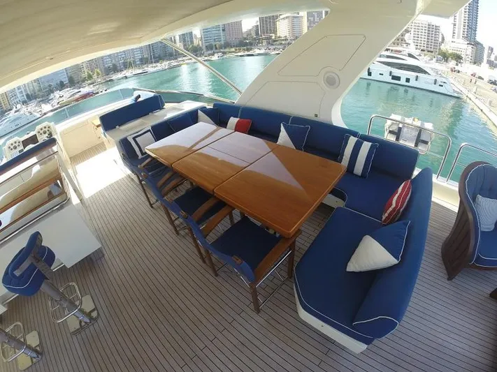  Yacht Photos Pics Luxurious 2008 Azimut 95 yacht deck with elegant seating and dining area.