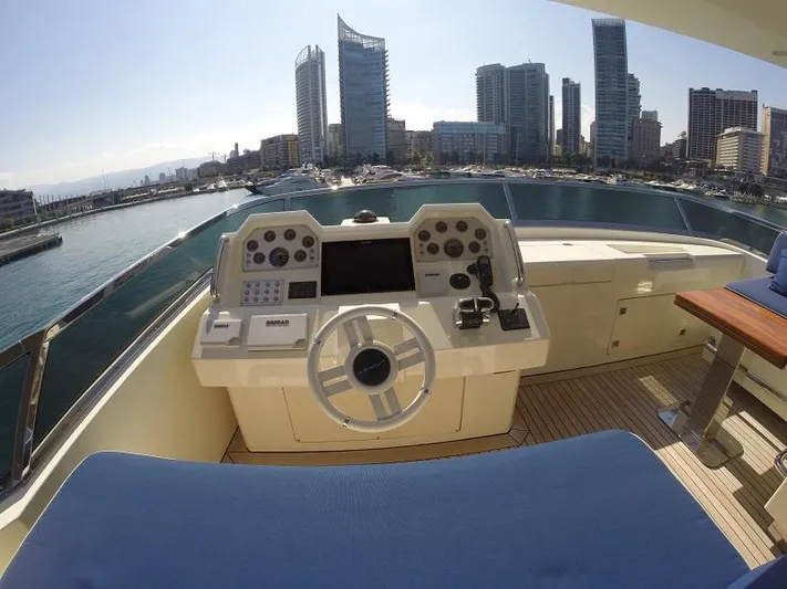  Yacht Photos Pics Helm of 2008 Azimut 95 yacht overlooking urban skyline and marina.