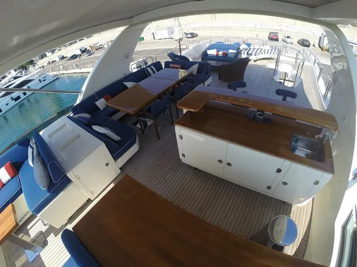  Yacht Photos Pics Luxurious 2008 Azimut 95 yacht deck with elegant seating and dining area.
