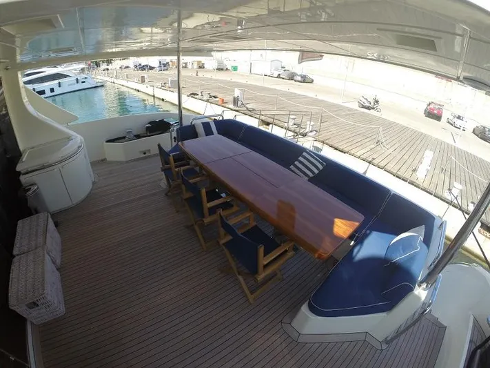  Yacht Photos Pics Spacious deck of 2008 Azimut 95 yacht with elegant seating and dining area.