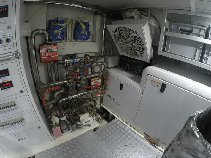  Yacht Photos Pics Engine room of a 2008 Azimut 95 yacht, featuring complex piping and control systems.
