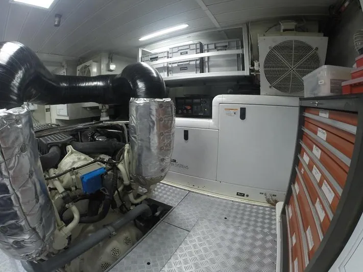  Yacht Photos Pics Engine room of a 2008 Azimut 95 yacht, featuring machinery and storage compartments.