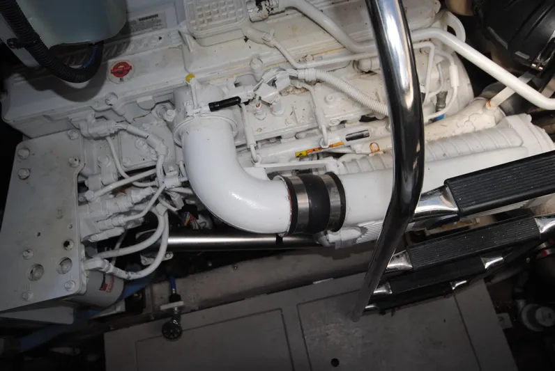  Yacht Photos Pics Engine compartment of 2017 Sea Ray Sundancer 510 yacht, featuring white piping and metal railings.