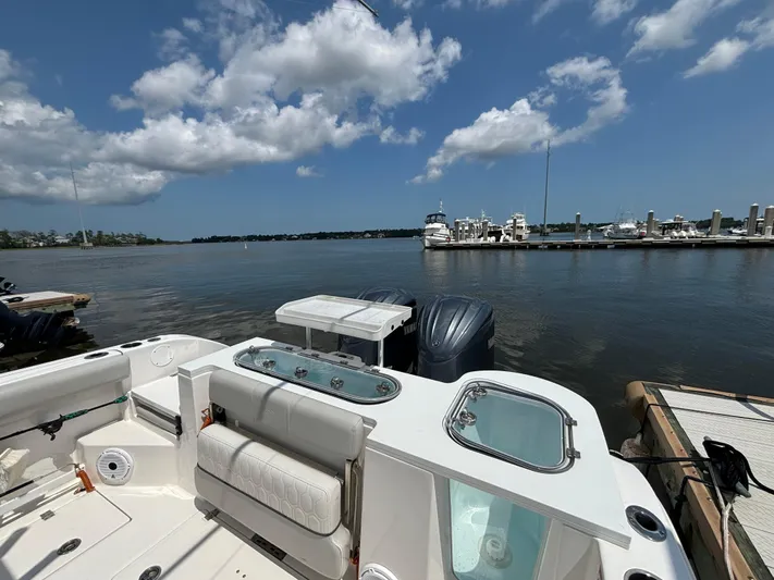  Yacht Photos Pics 2021 Sea Fox 288 Commander boat docked by a marina under a clear blue sky.