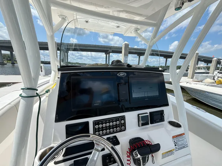  Yacht Photos Pics 2021 Sea Fox 288 Commander boat dashboard with modern controls and steering wheel.