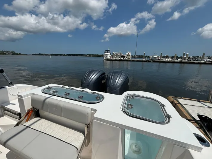  Yacht Photos Pics 2021 Sea Fox 288 Commander boat with dual engines docked by a marina.