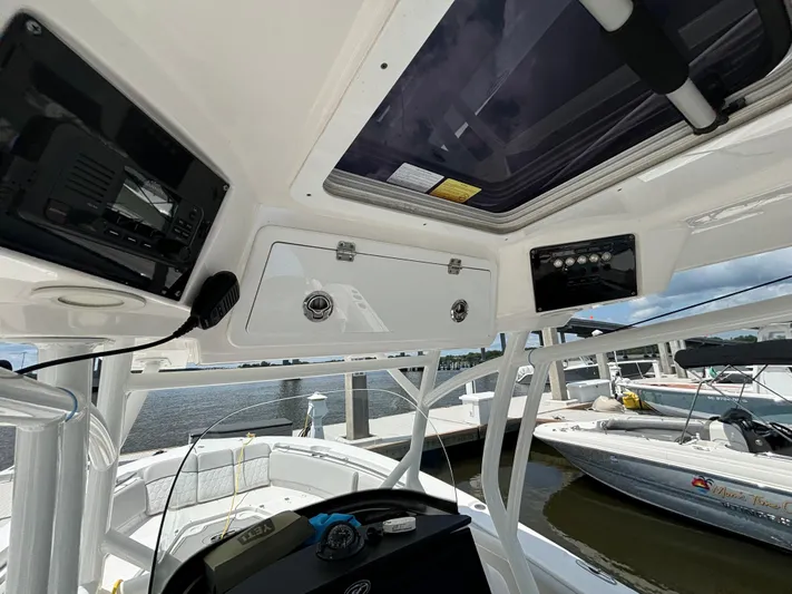  Yacht Photos Pics 2021 Sea Fox 288 Commander boat interior with control panel and seating area.