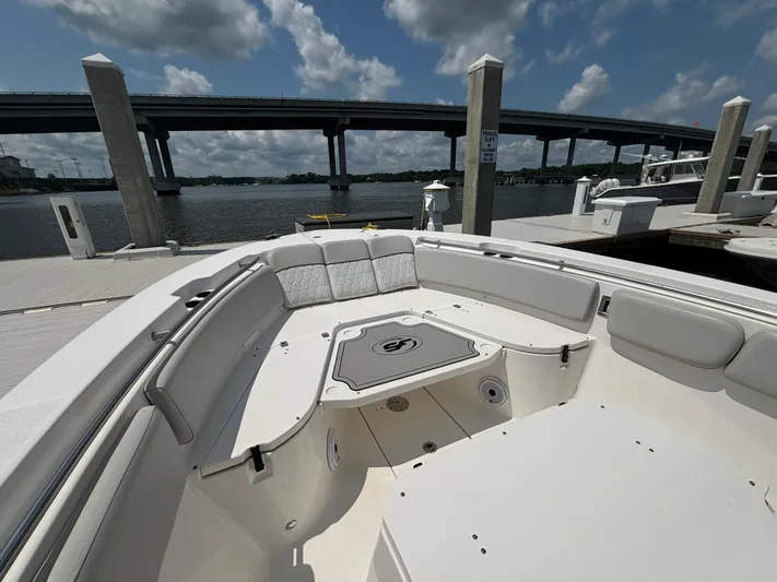  Yacht Photos Pics 2021 Sea Fox 288 Commander boat docked under a bridge on a sunny day.