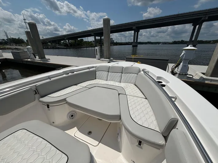  Yacht Photos Pics 2021 Sea Fox 288 Commander boat with spacious seating at a marina.