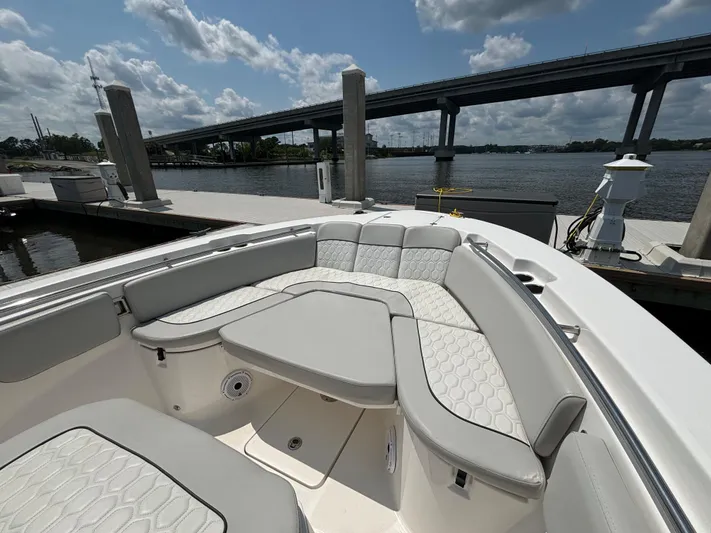  Yacht Photos Pics 2021 Sea Fox 288 Commander boat with spacious seating at a marina.