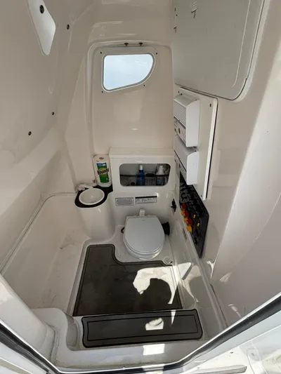  Yacht Photos Pics 2021 Sea Fox 288 Commander boat interior with compact marine toilet.