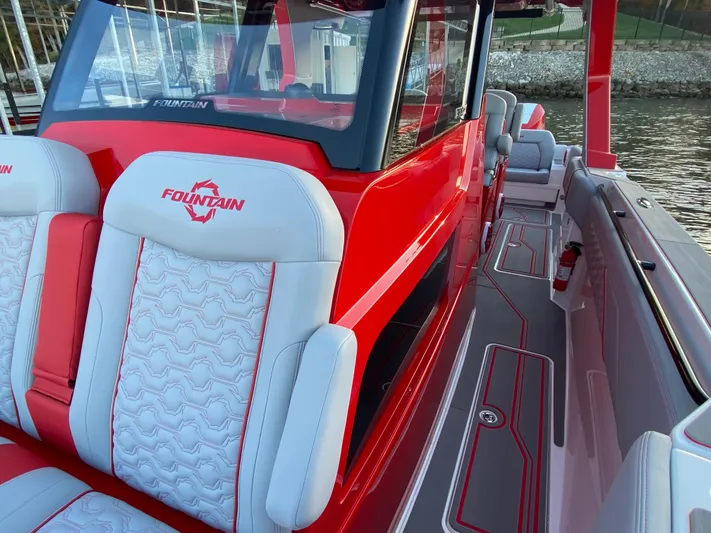  Yacht Photos Pics 2024 Fountain 38 SCX boat with red and white seating, sleek design, and modern features.