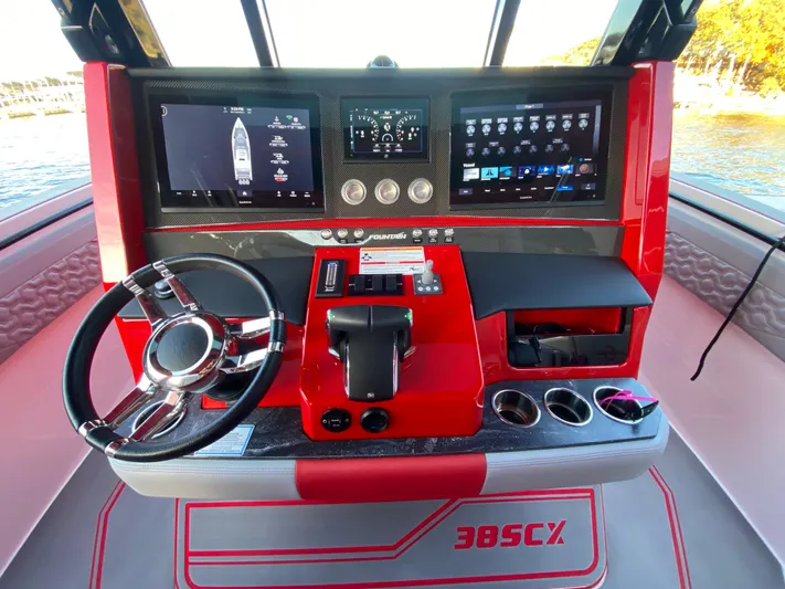  Yacht Photos Pics 2024 Fountain 38 SCX boat dashboard with modern controls and digital displays.