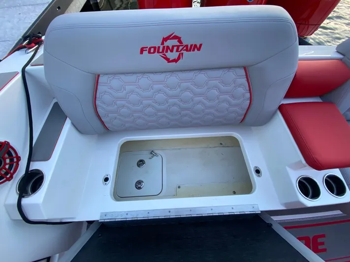  Yacht Photos Pics 2024 Fountain 38 SCX boat seat with storage compartment and cup holders.