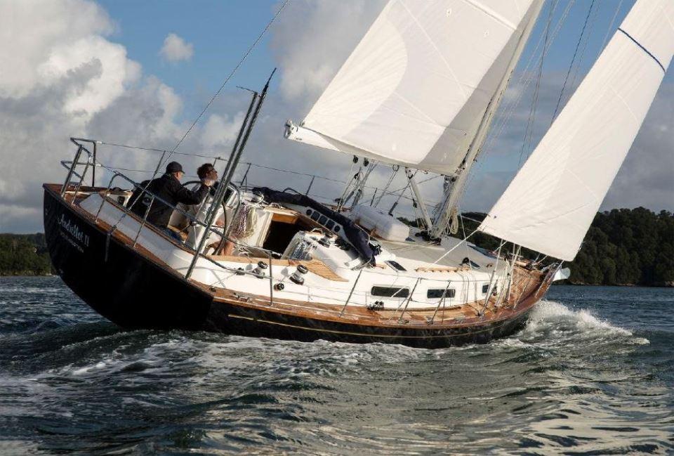 Sailing yacht Rustler 37, 2025 model, navigating through water with full sails.