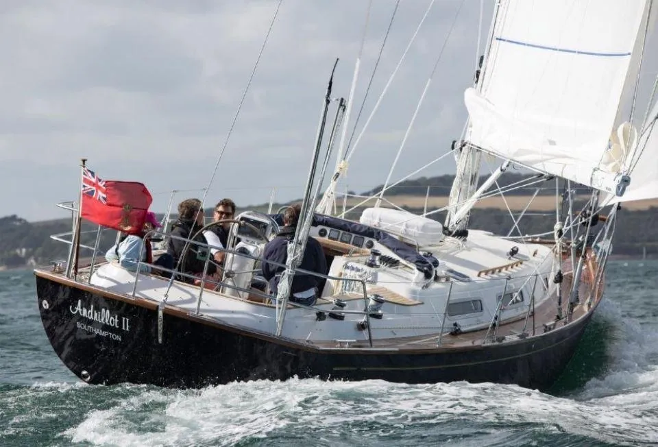 Sailing yacht Rustler 37, 2025 model, navigating coastal waters with crew onboard.