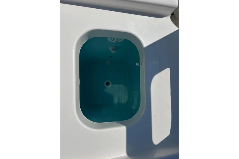  Yacht Photos Pics 2024 Pursuit S 328 Sport boat's livewell with blue interior.