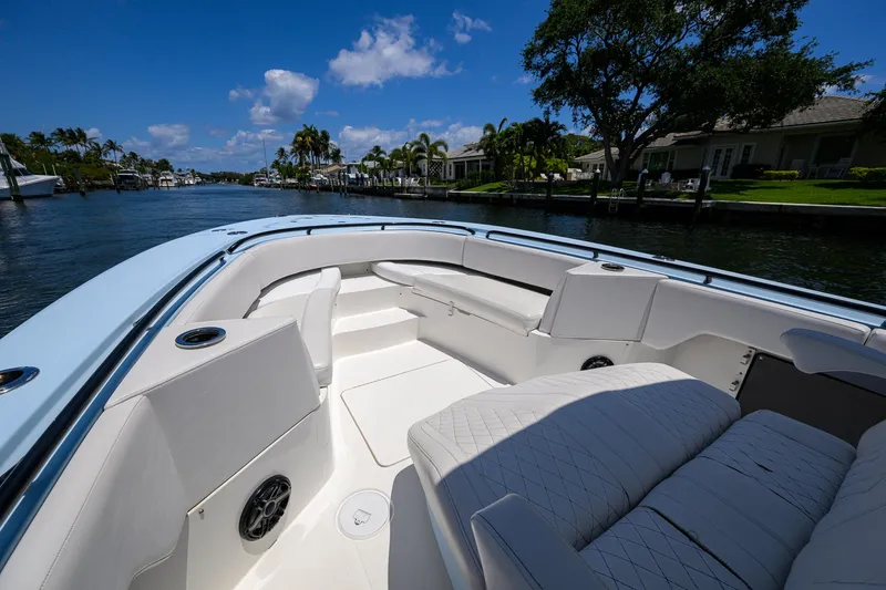  Yacht Photos Pics 2022 Fountain 34 CC boat interior with seating, cruising on a sunny day.