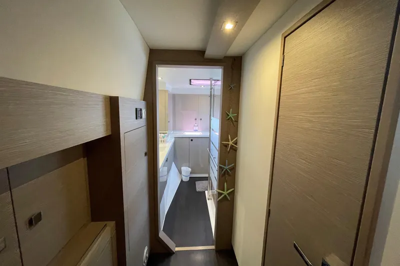 No Brainer Yacht Photos Pics Interior hallway of 2022 Fountaine Pajot Catamaran Astrea 42 with modern design elements.