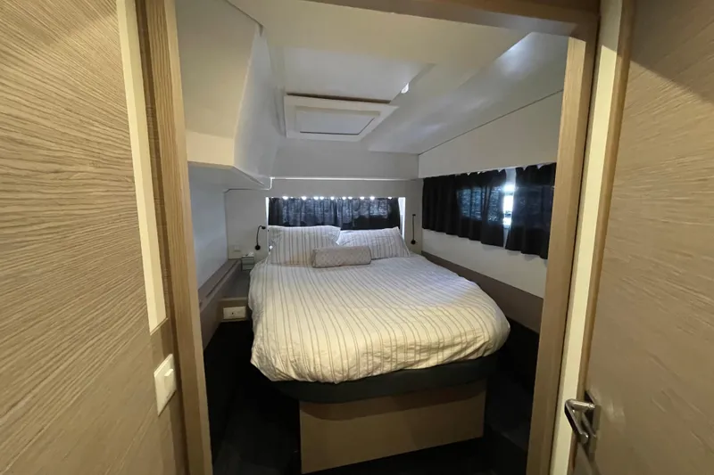 No Brainer Yacht Photos Pics Luxurious bedroom interior of 2022 Fountaine Pajot Catamaran Astrea 42 with cozy bed.