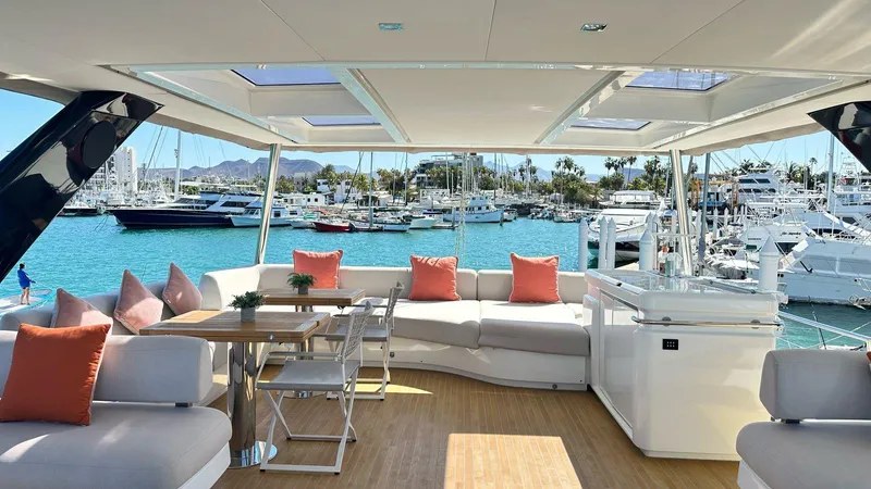  Yacht Photos Pics Luxurious 2022 Lagoon 65 yacht interior with spacious seating and marina view.