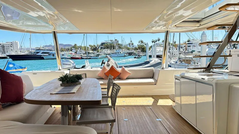  Yacht Photos Pics Luxurious interior of a 2022 Lagoon 65 yacht with marina view.