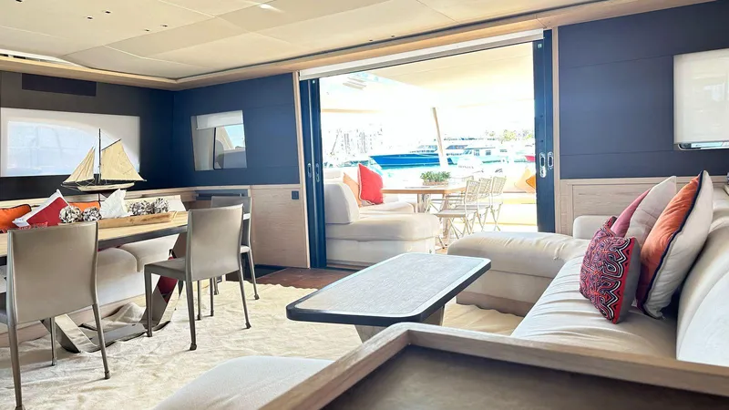  Yacht Photos Pics Luxurious interior of 2022 Lagoon 65 yacht with elegant seating and dining area.