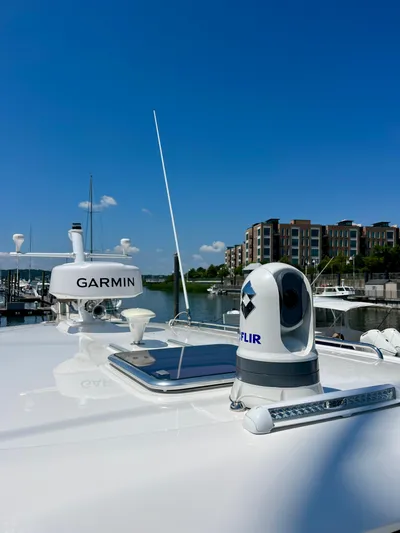 Mr. Sandman Yacht Photos Pics 2023 Back Cove 34O yacht with Garmin and FLIR equipment, docked near modern buildings.