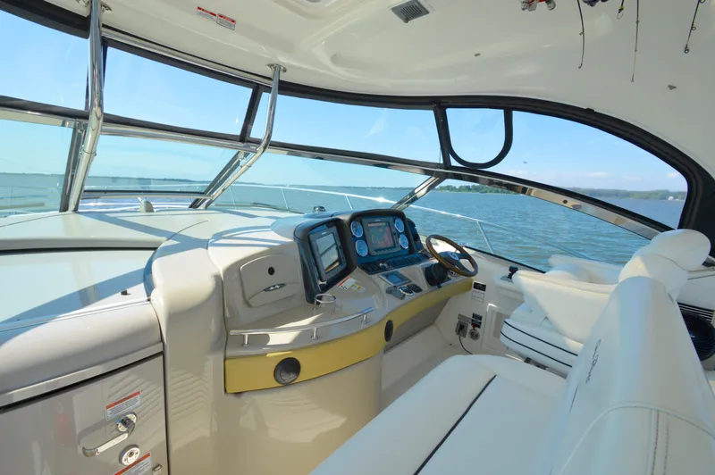  Yacht Photos Pics 2008 Sea Ray 44 Sundancer helm with navigation equipment, overlooking serene waters.