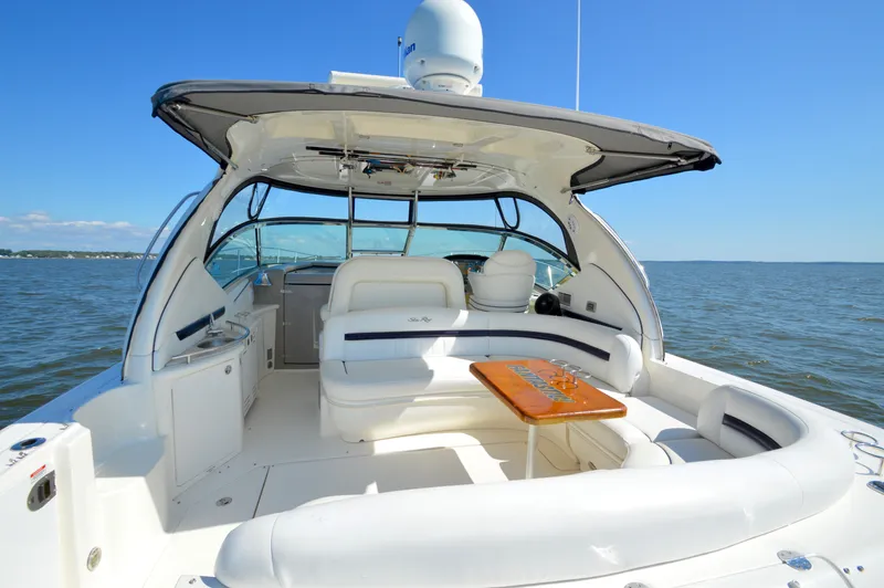  Yacht Photos Pics 2008 Sea Ray 44 Sundancer yacht with spacious deck and seating, cruising on open water.