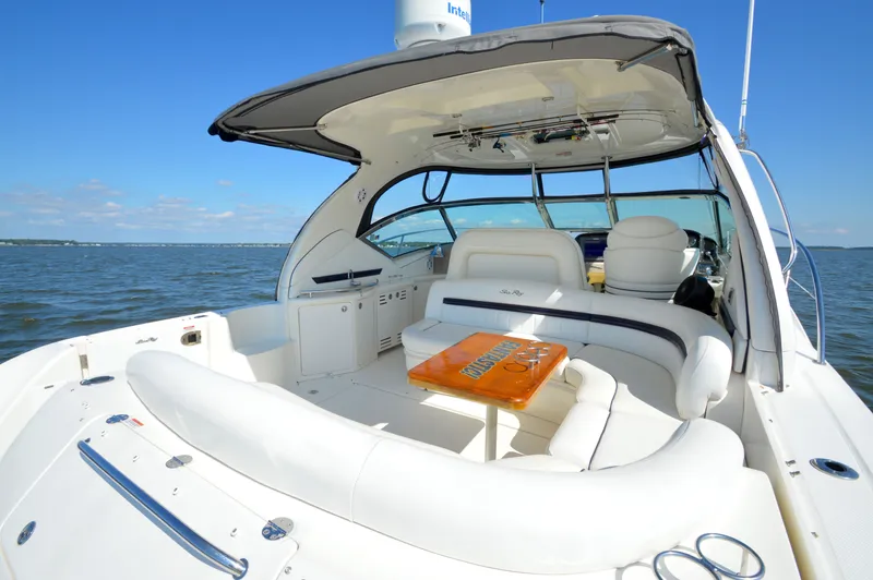  Yacht Photos Pics 2008 Sea Ray 44 Sundancer yacht with spacious seating, cruising on open water.