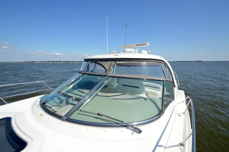  Yacht Photos Pics 2008 Sea Ray 44 Sundancer yacht on open water under clear blue sky.