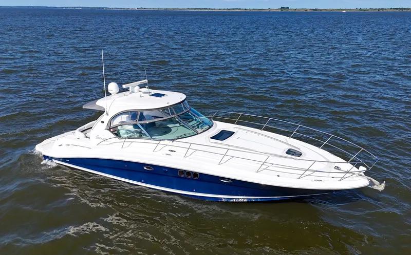  Yacht Photos Pics 2008 Sea Ray 44 Sundancer yacht cruising on open water.