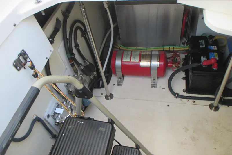 Worth Pursuit Yacht Photos Pics 2013 Pursuit SC 365i Sport Coupe engine compartment with fire extinguisher and battery.