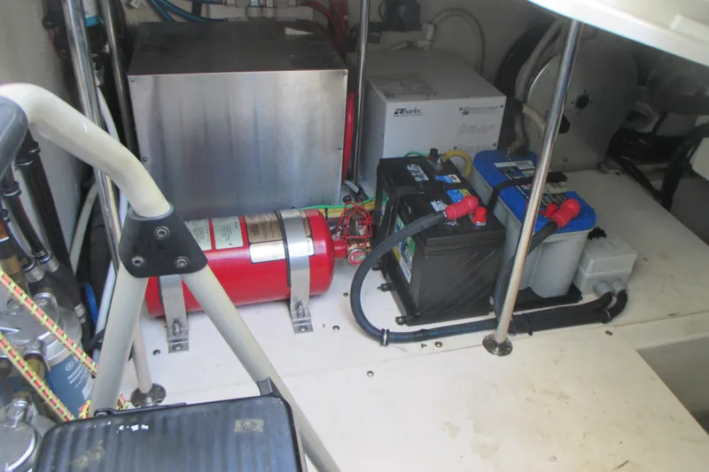 Worth Pursuit Yacht Photos Pics 2013 Pursuit SC 365i Sport Coupe engine compartment with batteries and fire extinguisher.