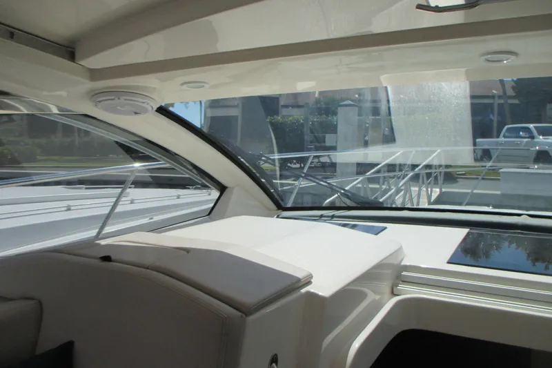 Worth Pursuit Yacht Photos Pics Interior view of 2013 Pursuit SC 365i Sport Coupe, showcasing sleek design and spacious seating.