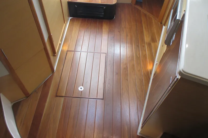 Worth Pursuit Yacht Photos Pics 2013 Pursuit SC 365i Sport Coupe interior with polished wooden flooring.