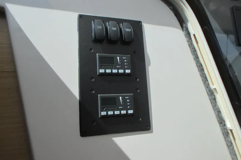 Worth Pursuit Yacht Photos Pics Control panel on 2013 Pursuit SC 365i Sport Coupe boat interior.