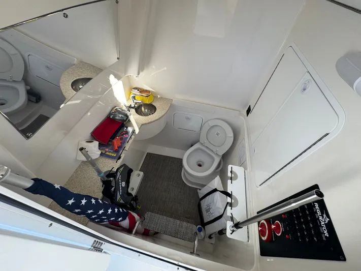 Temp Tag Yacht Photos Pics Interior of a Regulator 31 yacht with toilet and sink.