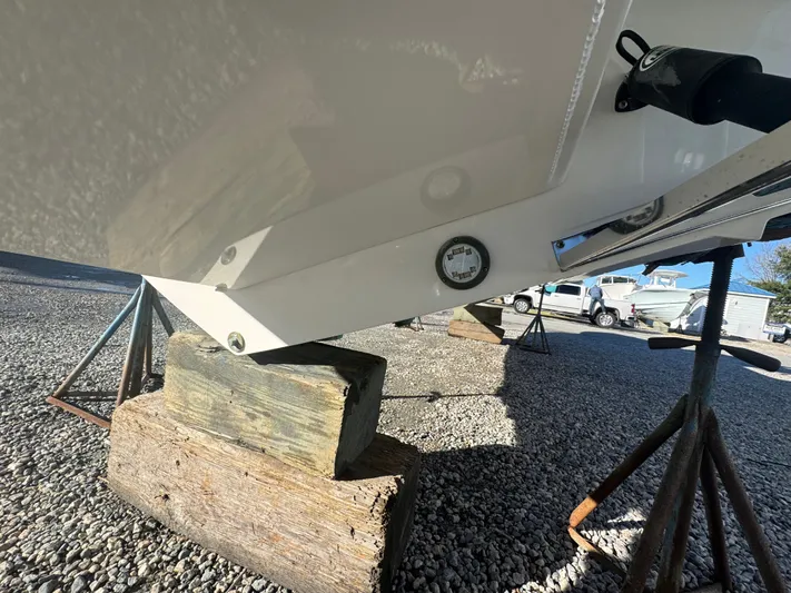 Temp Tag Yacht Photos Pics 2022 Regulator 31 boat supported on wooden blocks.