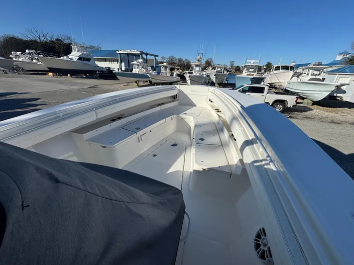 Temp Tag Yacht Photos Pics 2022 Regulator 31 boat on a lot with other boats.