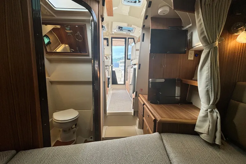  Yacht Photos Pics Interior of 2026 Ranger Tugs R-27 boat, featuring cozy cabin and modern amenities.