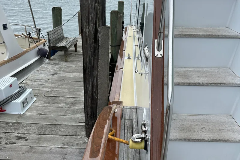 Gitana Yacht Photos Pics 1986 Wilbur Hunt Yachts docked, showing wooden deck and side view with steps.