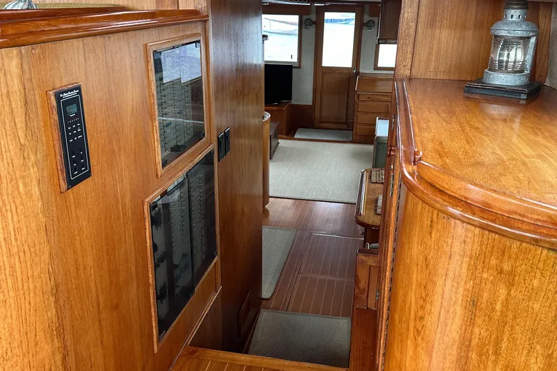 Gitana Yacht Photos Pics 1986 Wilbur Hunt Yachts interior with wooden finish and nautical decor.
