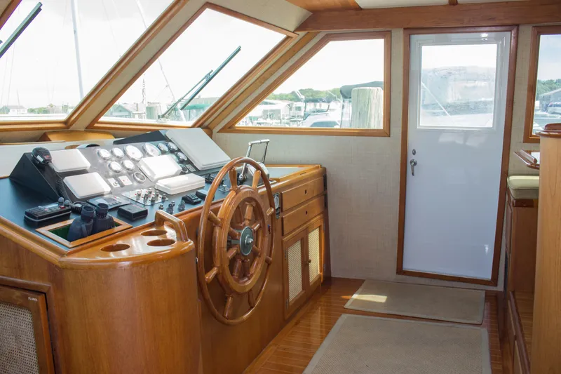 Gitana Yacht Photos Pics 1986 Wilbur Hunt Yachts helm with wooden steering wheel and control panel.