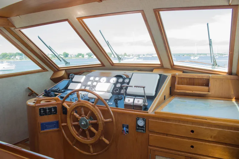 Gitana Yacht Photos Pics 1986 Wilbur Hunt Yachts helm with wooden steering wheel and navigation instruments.
