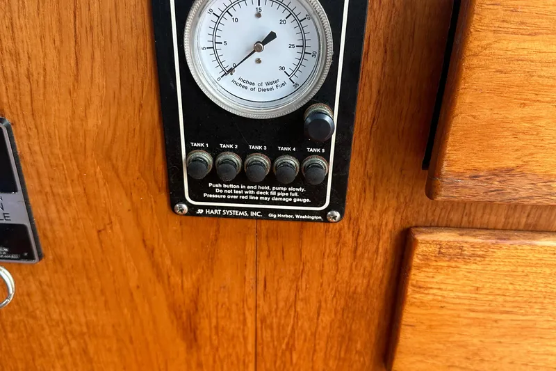 Gitana Yacht Photos Pics Fuel gauge panel on 1986 Wilbur Hunt Yachts, featuring tank indicators and wooden finish.