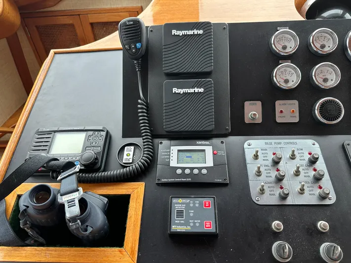 Gitana Yacht Photos Pics Control panel of a 1986 Wilbur Hunt Yachts with navigation and communication equipment.